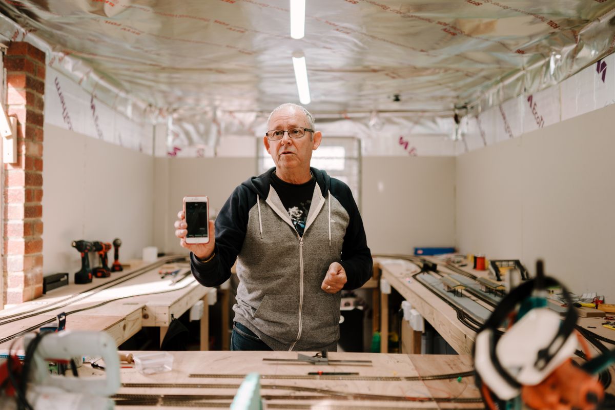 An older man using a smartphone, illustrating digital access in later life