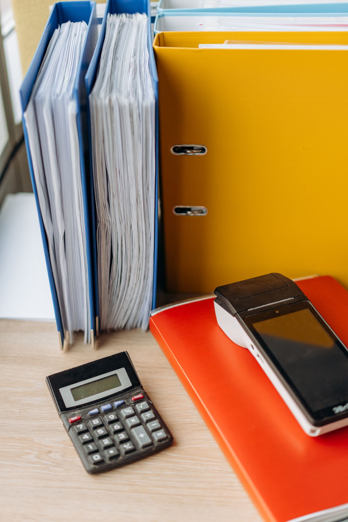 A calculator and financial paperwork, illustrating response and recovery cost analysis