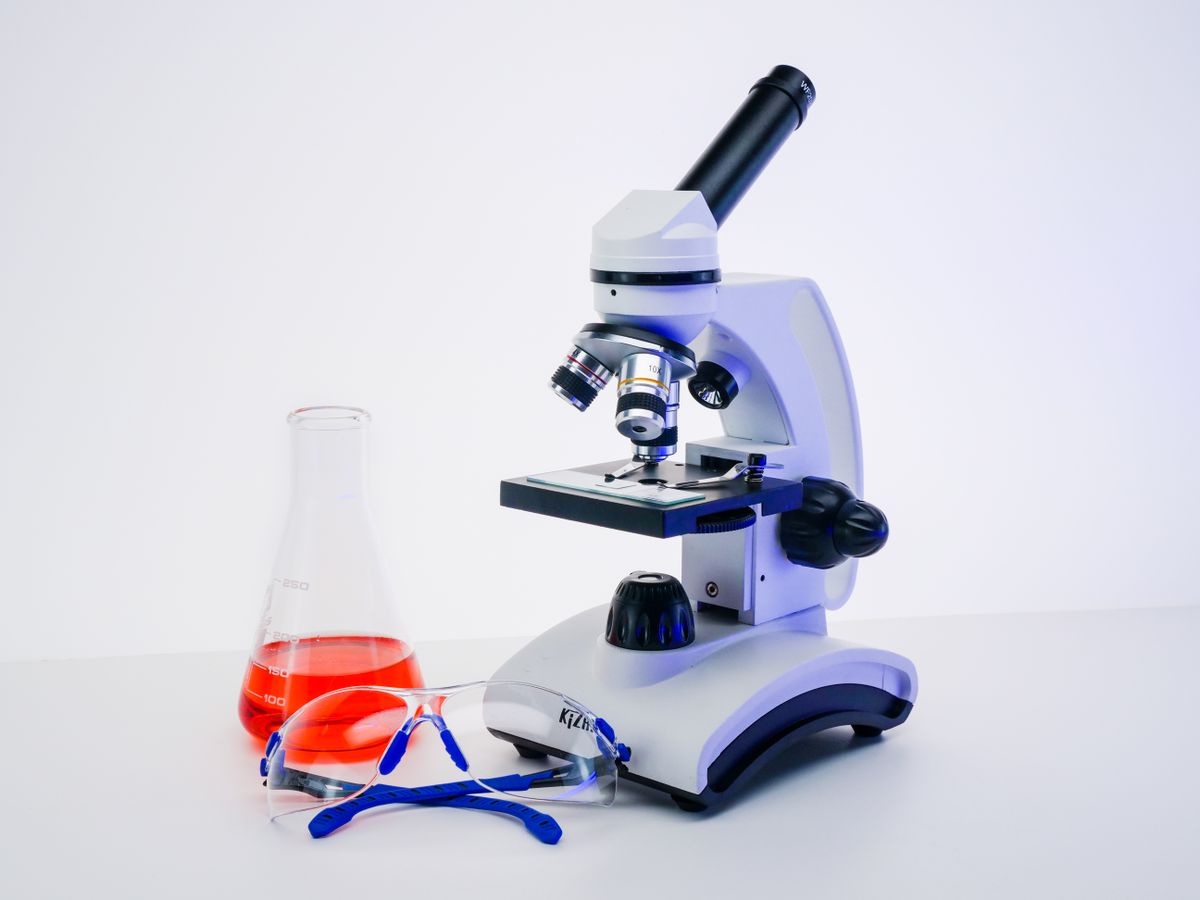 A microscope and laboratory equipment, illustrating the health-service context of tuberculosis research
